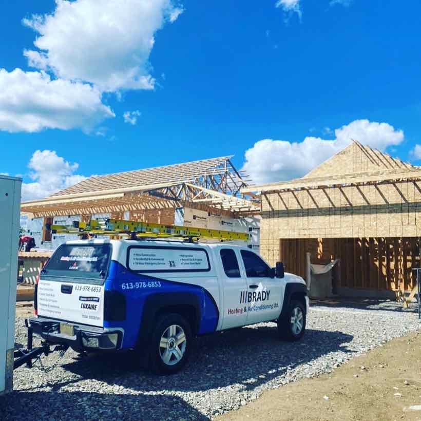 The BRADY service truck at a newly framed home, ready for the heating and cooling rough-in.